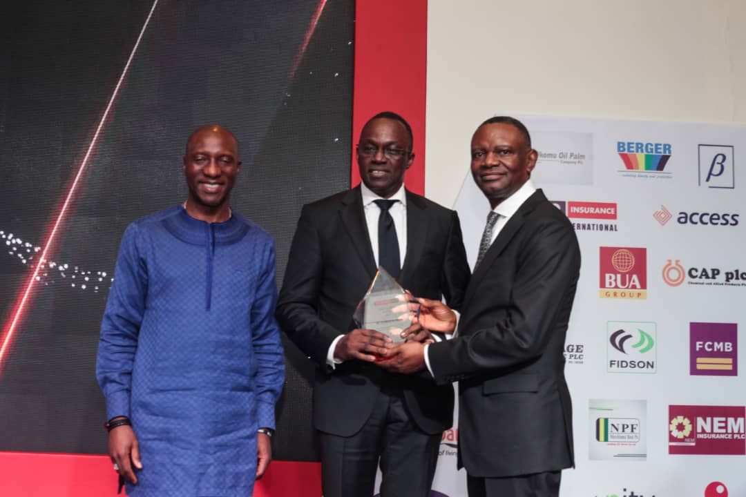 L-R Oscar Onyema, DG Nigeria Stock Exchange; Wole Oshin, MD Custodian Investment Plc receiving the Top 25 CEO Award presented by Frank Aigbogun, MD/CEO BusinessDay